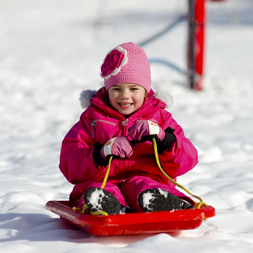 Kids toboganning at Perisher